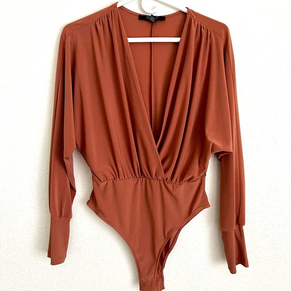 Forever 21 orange bodysuit. Only worn once!